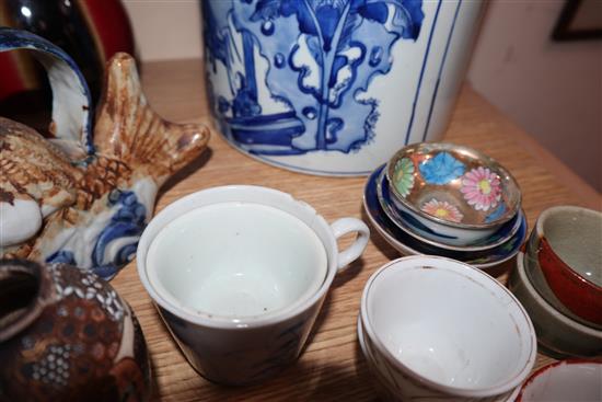 A quantity of Chinese and other porcelain including tea bowls, a bottle vase and a large blue and white brush pot